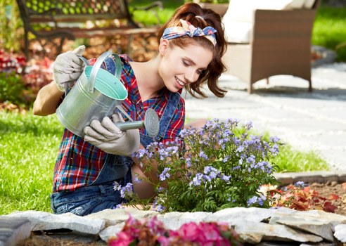 Operative using protective equipment while operating garden machinery